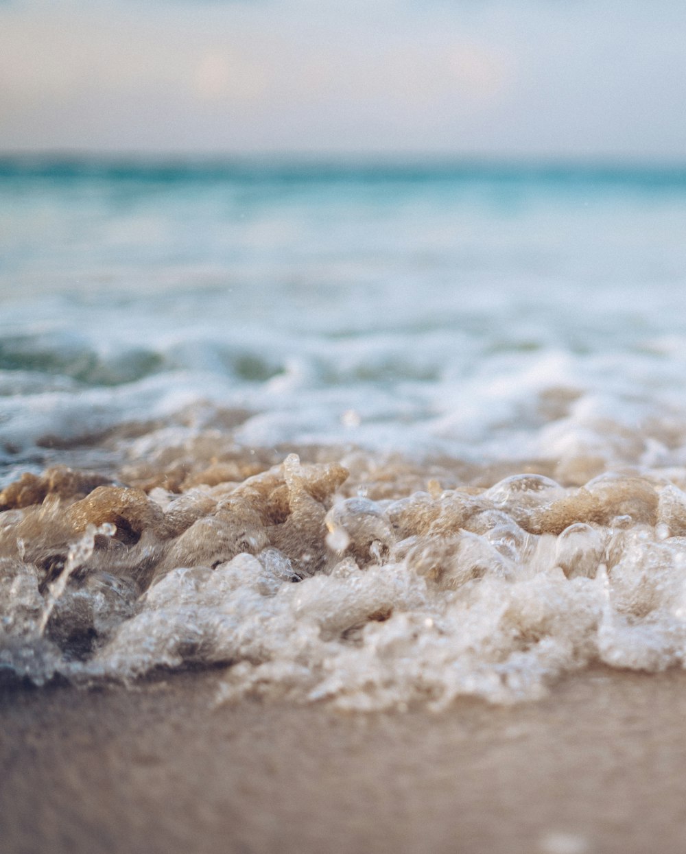 sea wave rolling into beach