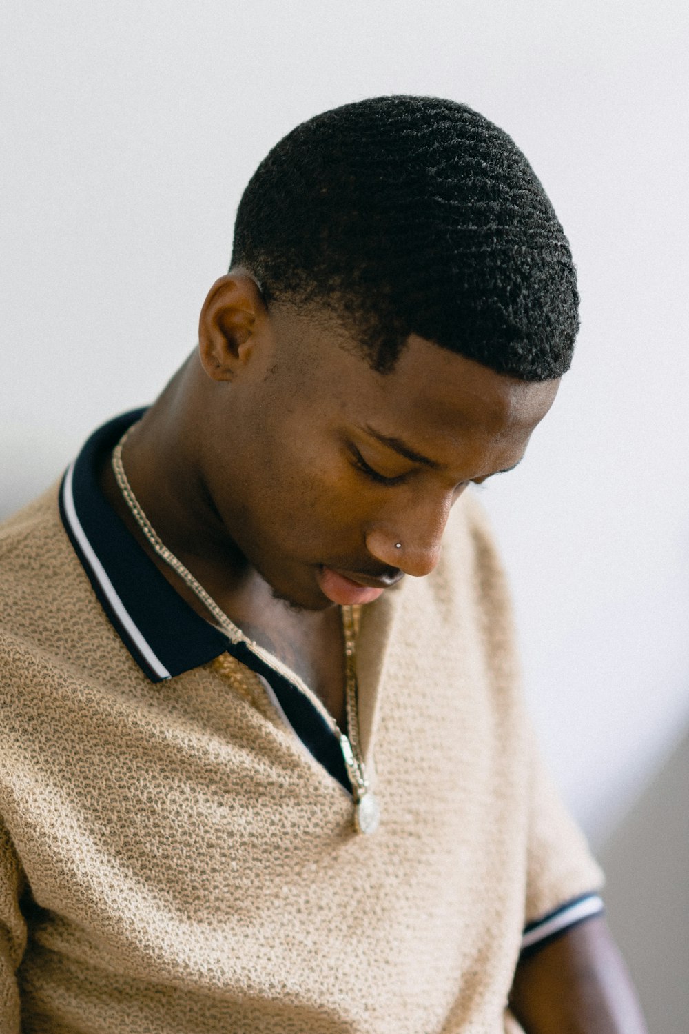 man wearing yellow polo shirt