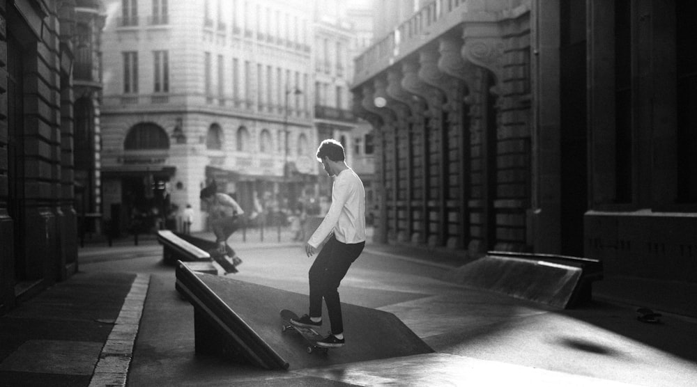 grayscale photography of man skateboarding