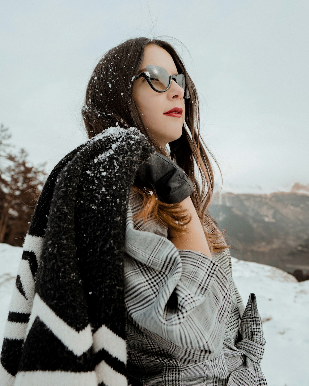 woman holding black coat