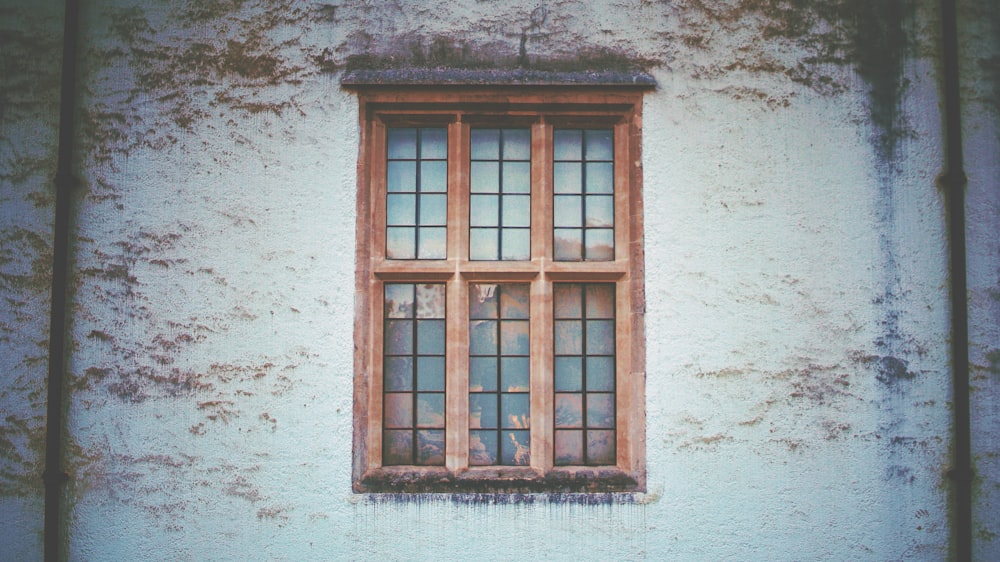 brown wooden framed glass window