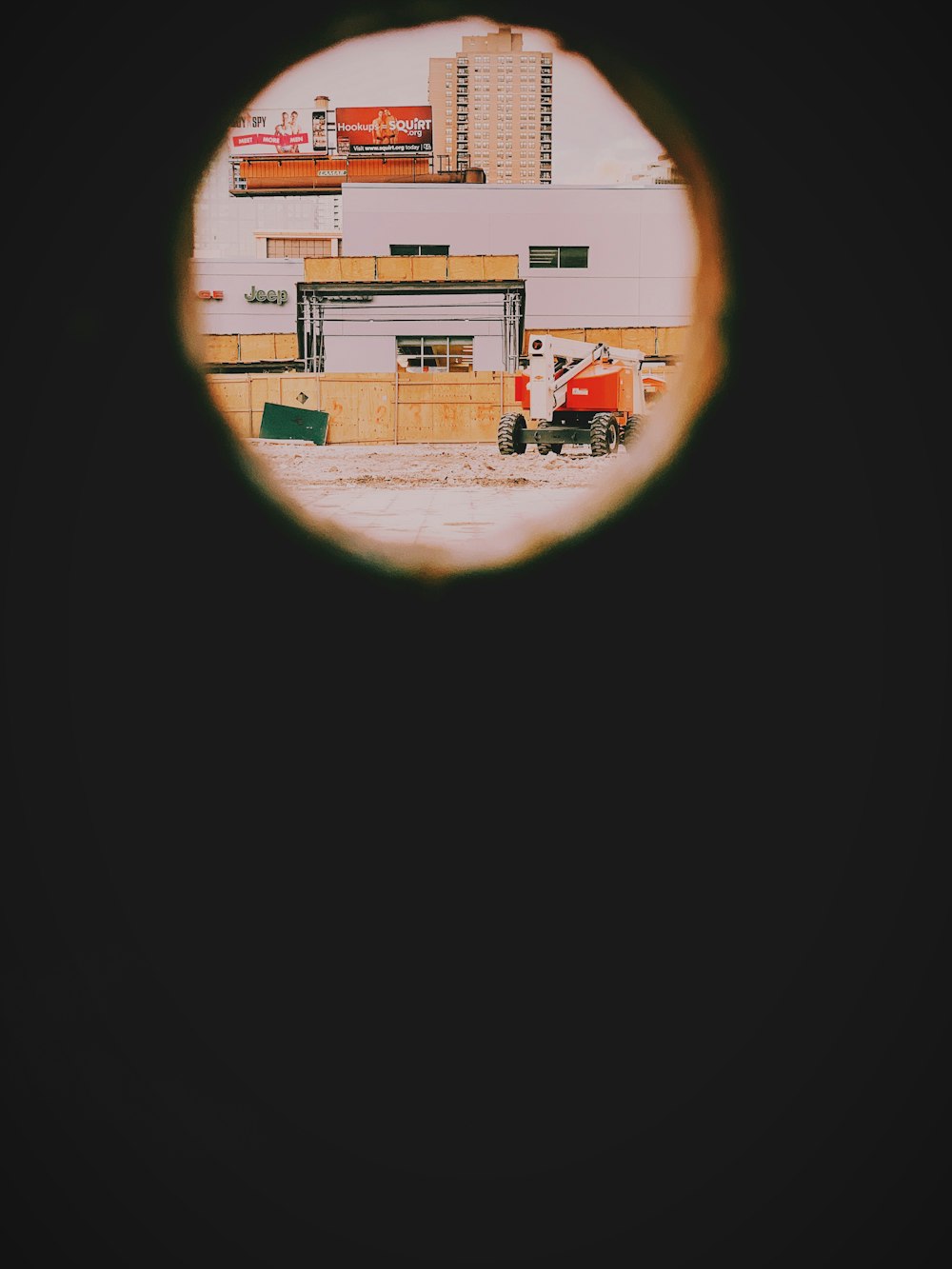 red and white truck near building