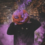 man wearing jack-o-lantern