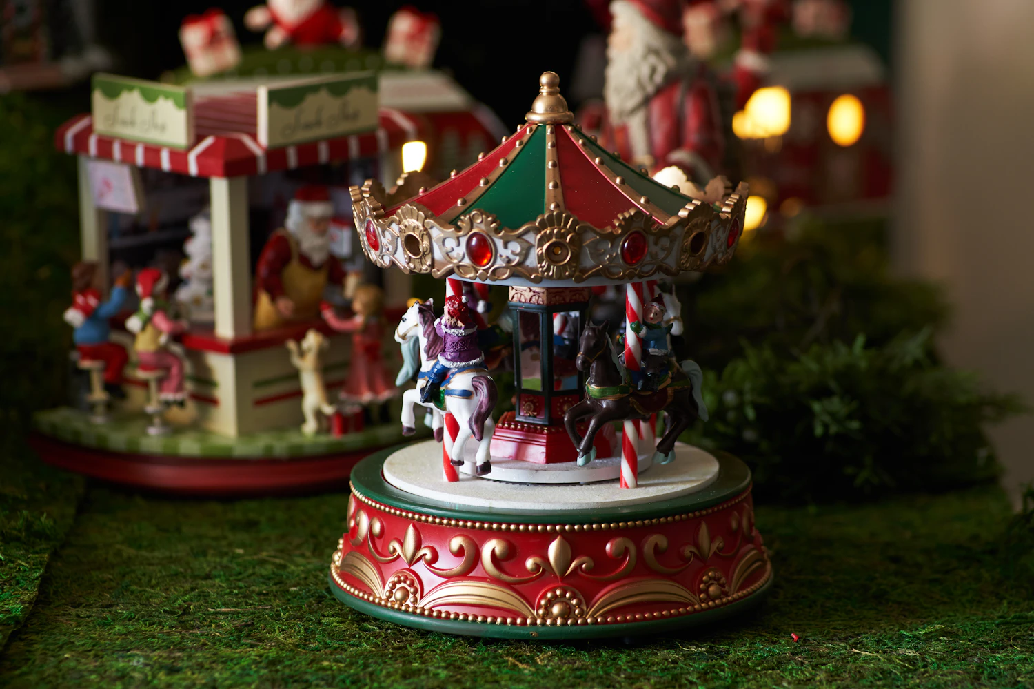 Yuletide Carousel: a red and green carousel music box among winter decorations