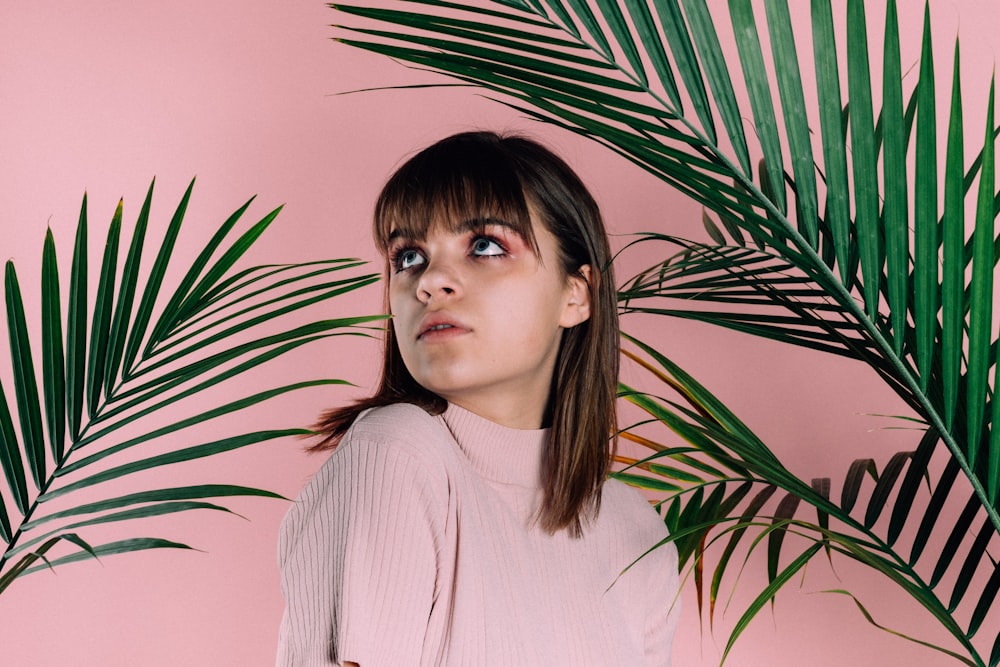 woman wearing pink turtleneck shirt