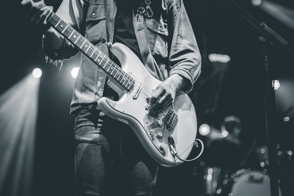 man playing electric guitar