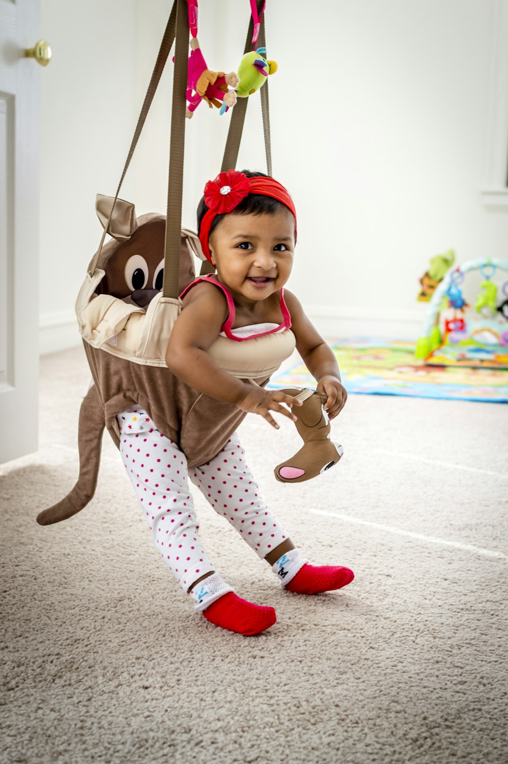 girl on hanging jumper smiling