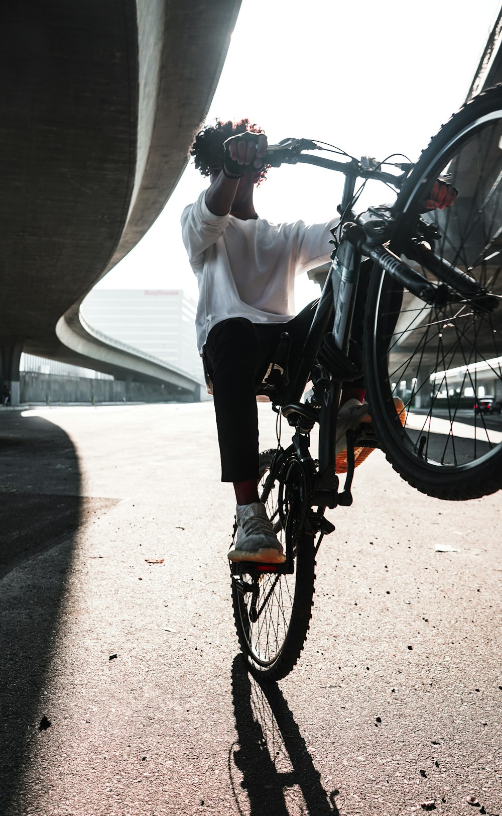 man riding hardtail bike during daytime