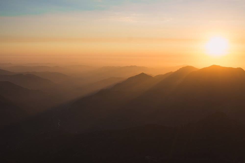 landscape photography of mountains during sunset