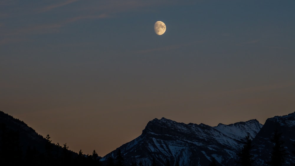 mountain under gray sky during nighttime