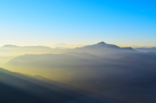 mountains covered in mist in Province of Lecco Italy