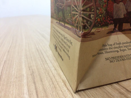 Close-up of eco-friendly paper bags with verdapak logo, highlighting texture and quality.