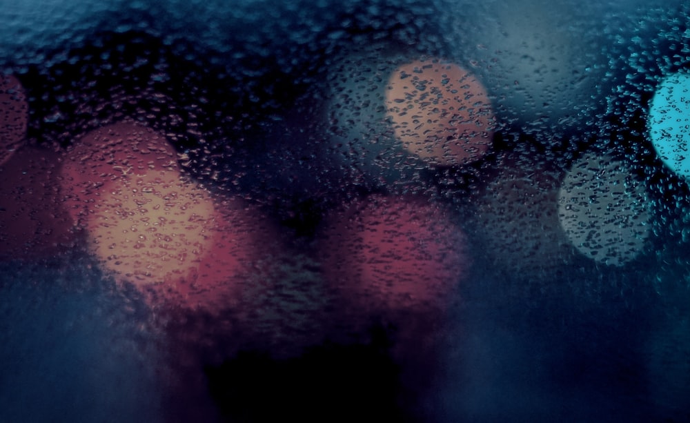 a close up of a window with rain drops