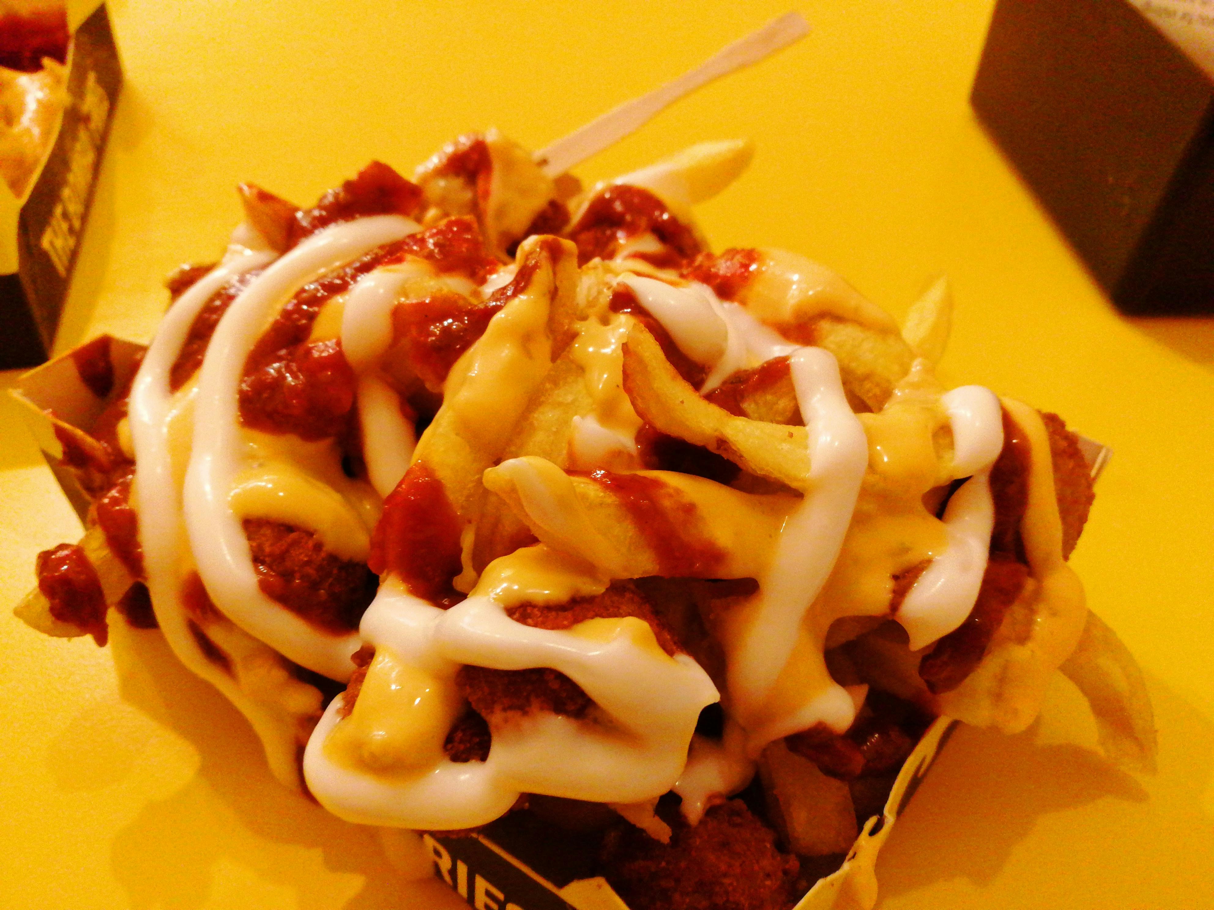 Cheese French Fries — Fries loaded with cheese sauce, Indian café food photography with warm colours and appetising presentation
