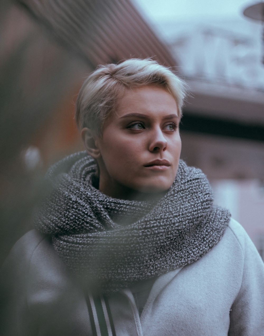 close-up photo of woman in gray scarf