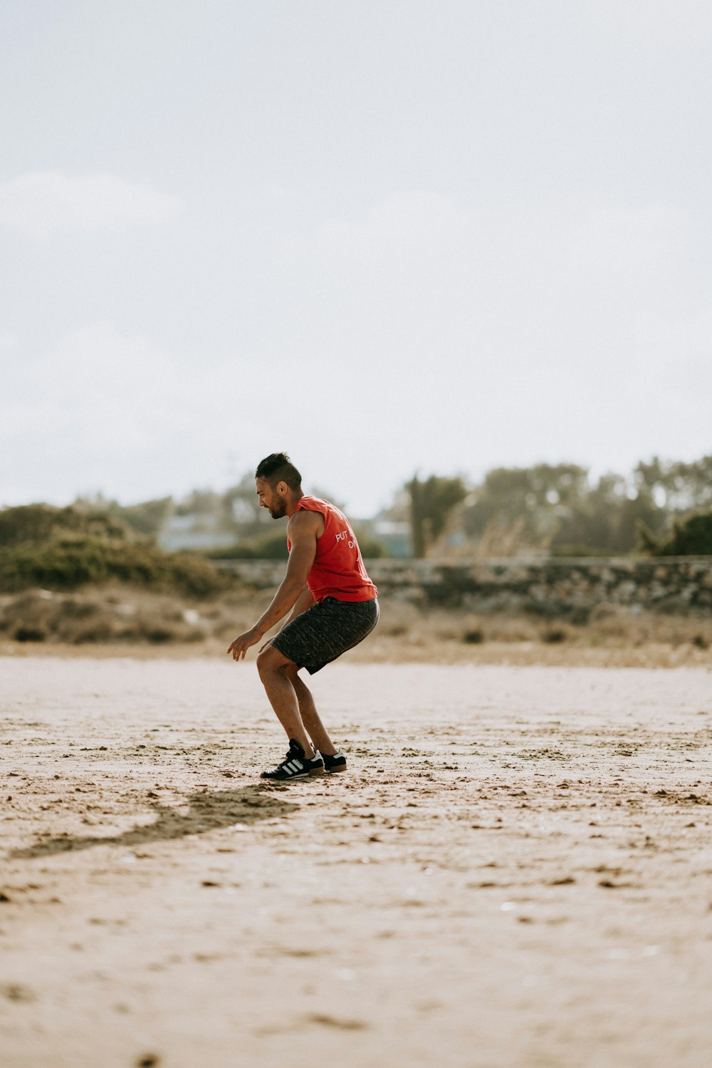 man about to sit on sand