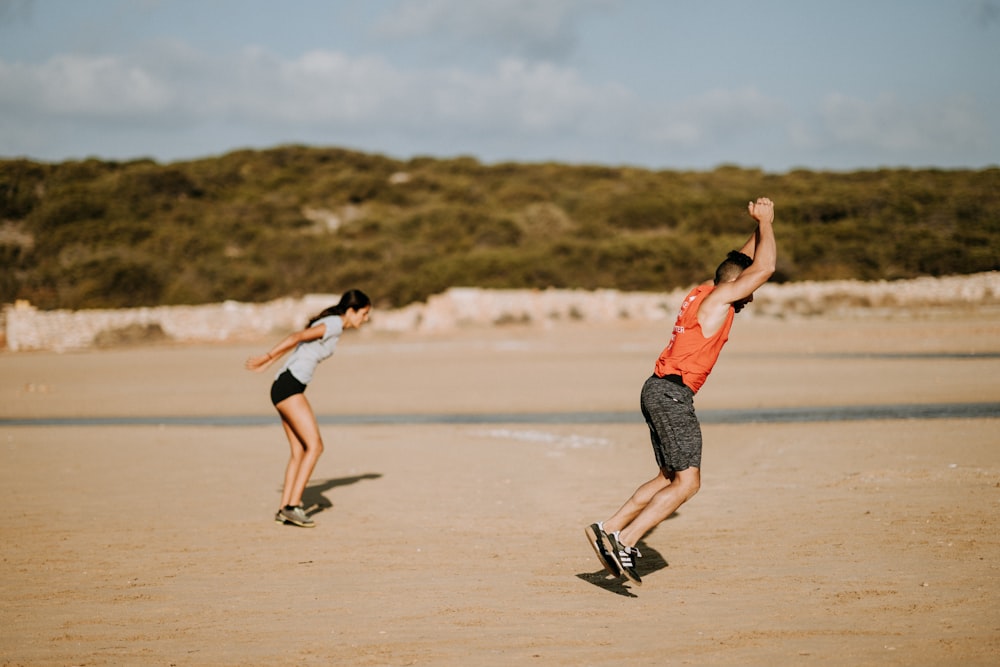 man and woman jumping