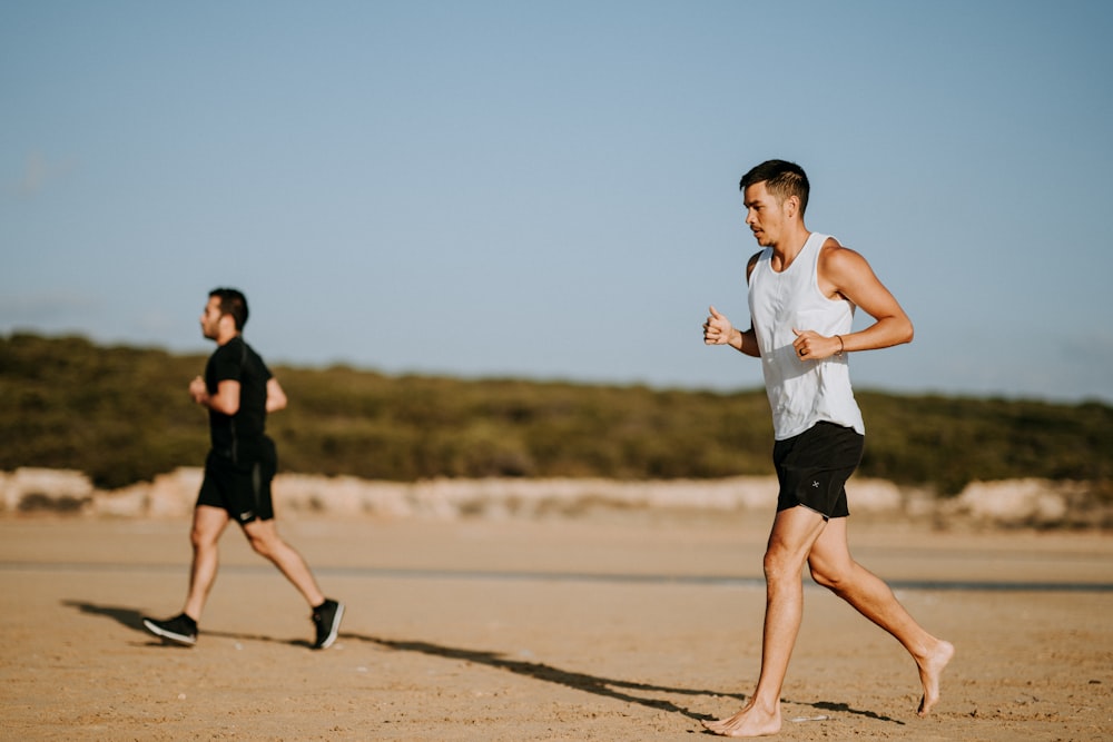 two men running on field