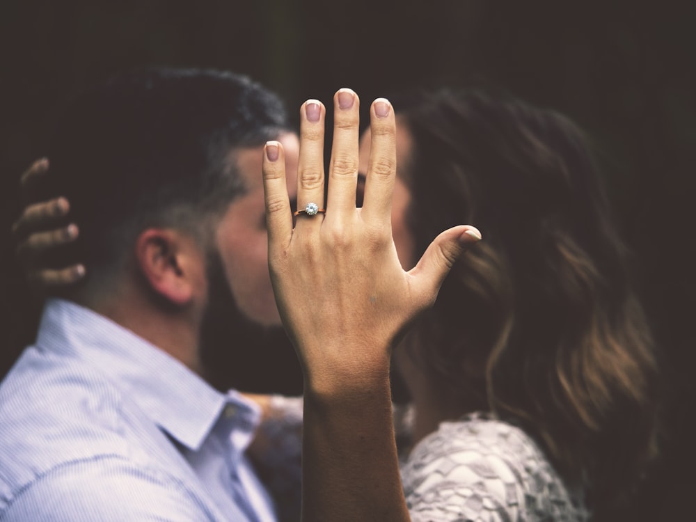 man and woman kissing