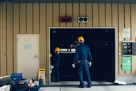 man standing in front of open doorway