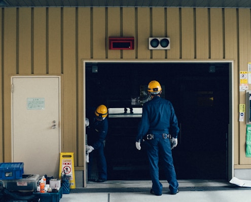 man standing in front of open doorway