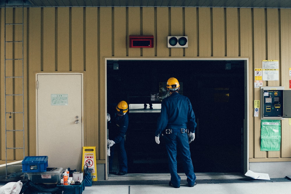 man standing in front of open doorway