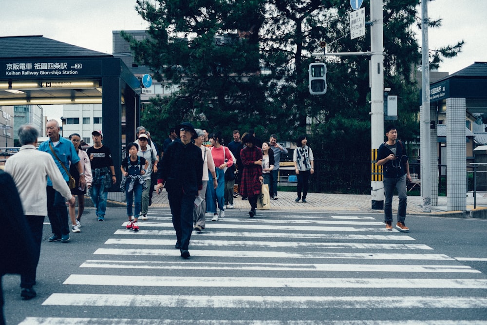 group of people walking on road