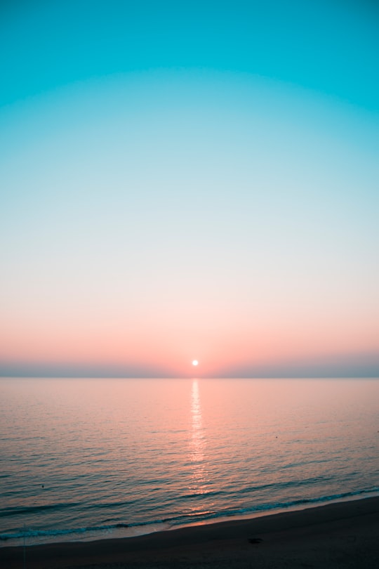 calm sea under clear blue sky in Anzio Italy