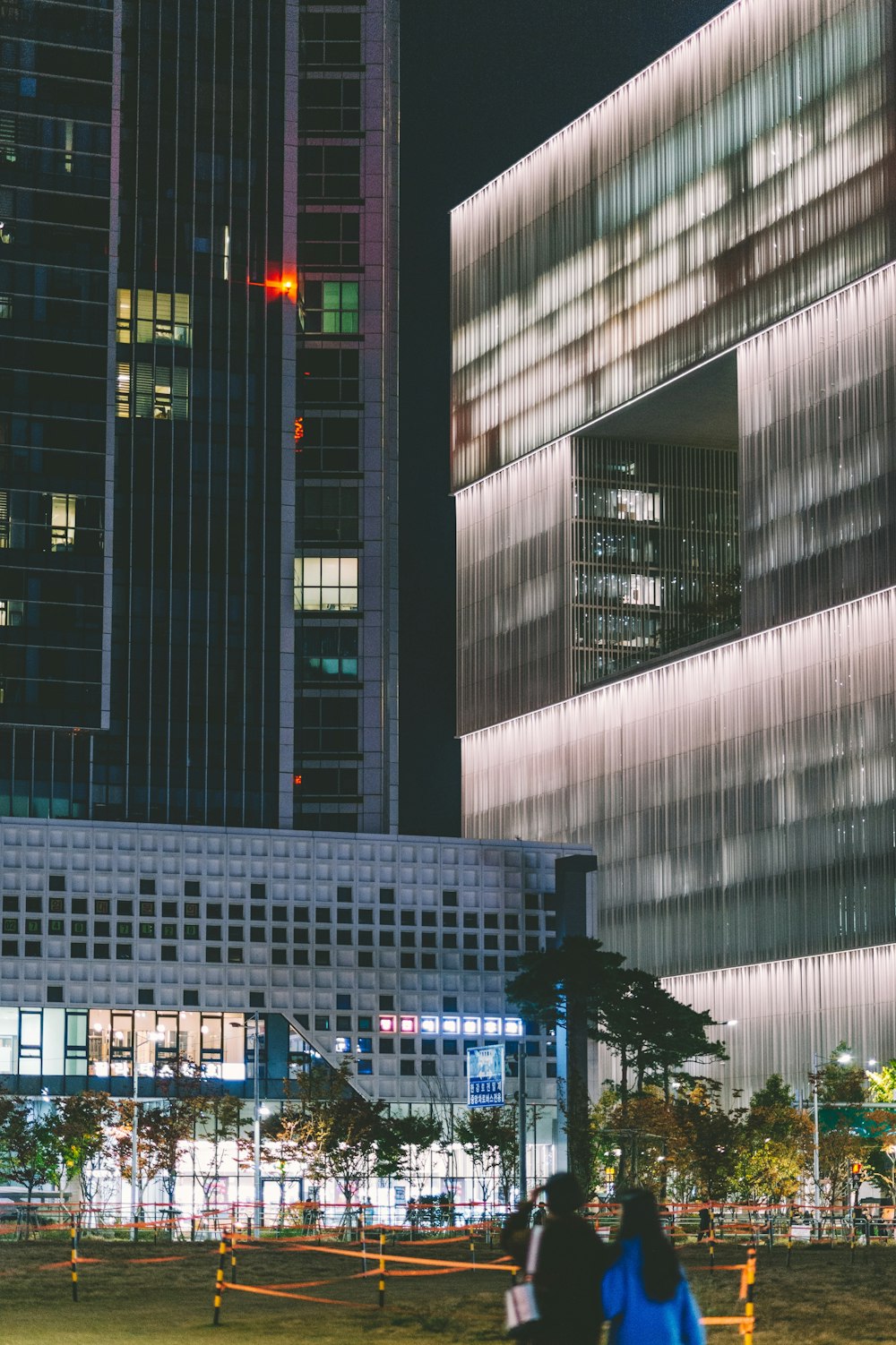 couple standing in front of building