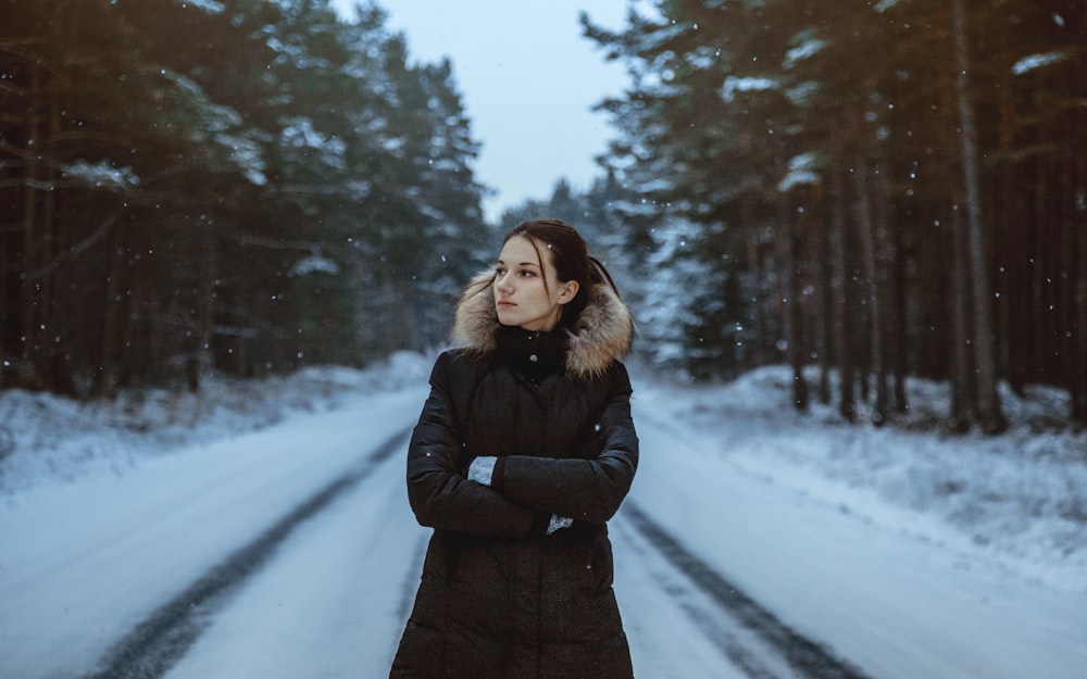woman standing on snow field