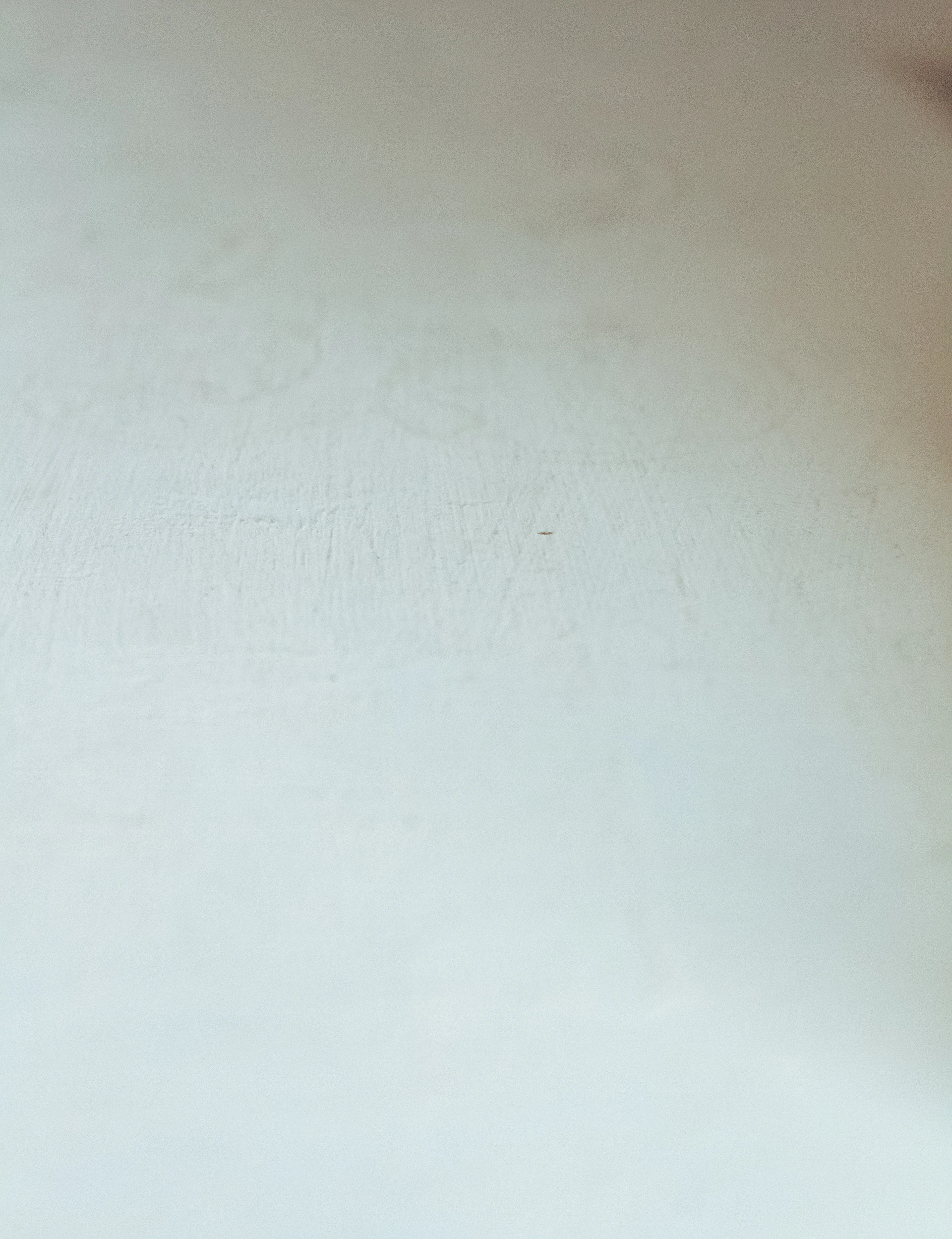 a close up of a snowboard on a white surface