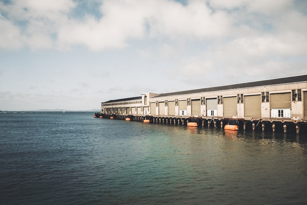 gray building near body of water