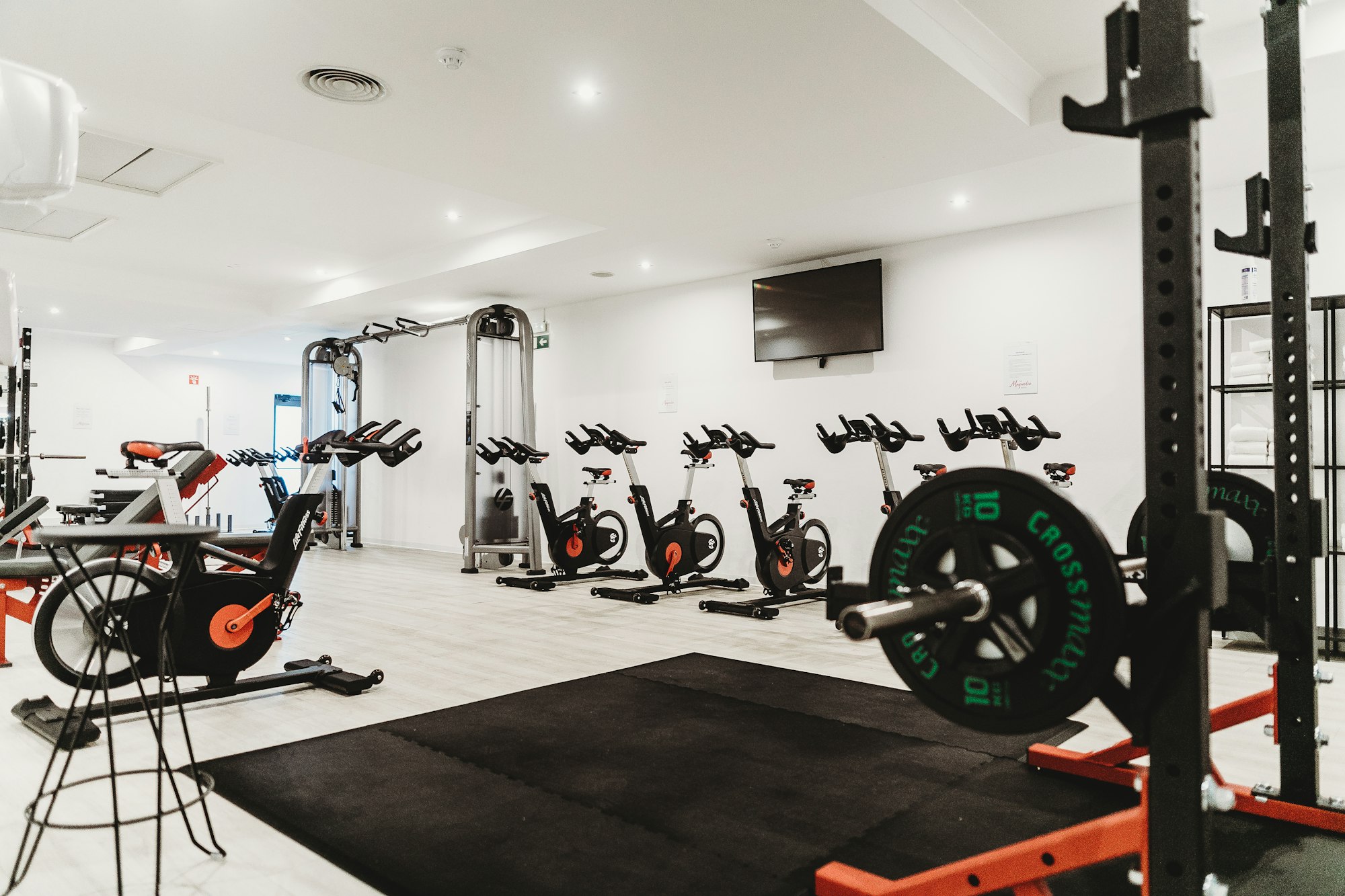 A fitness gym with various workout equipment.