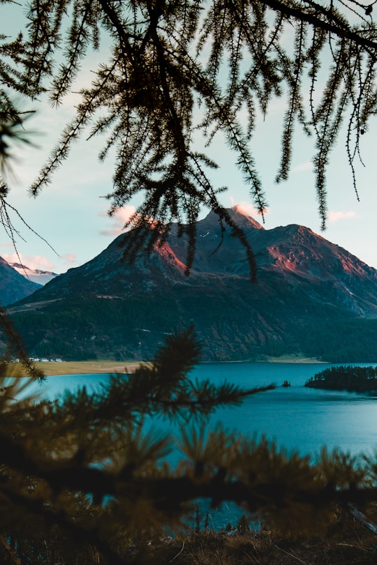 mountain beside body of water in Engadin Switzerland