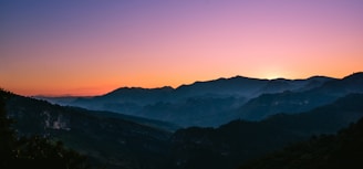A breathtaking view of a mountain range at sunset.