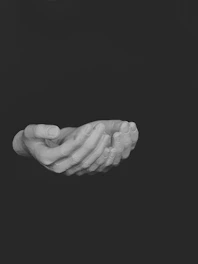 Gold line art showing a secure handshake symbolizing trusted human handover on dark background