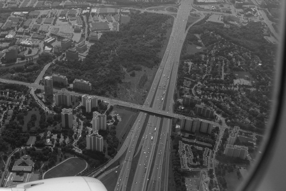 aerial grayscale photography of vehicles passing highway
