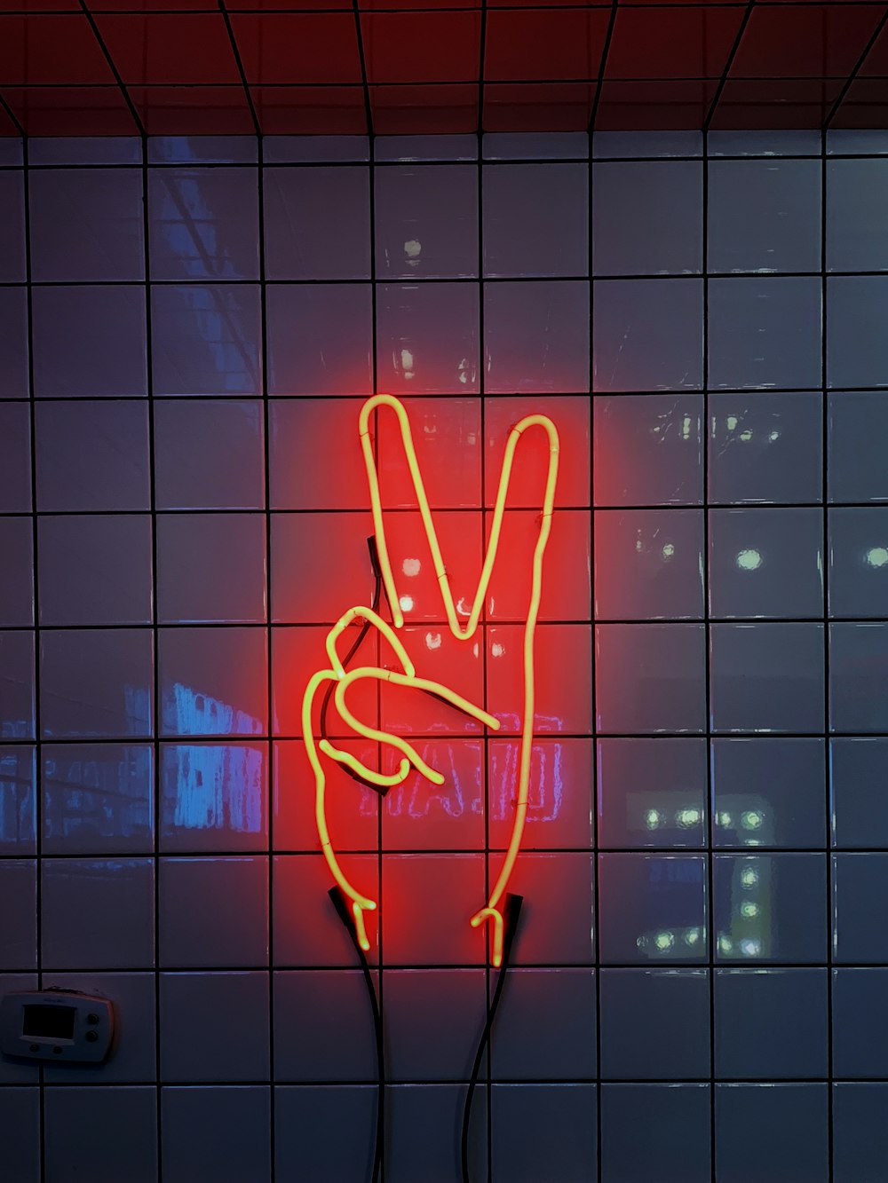 red peace sign neon signage