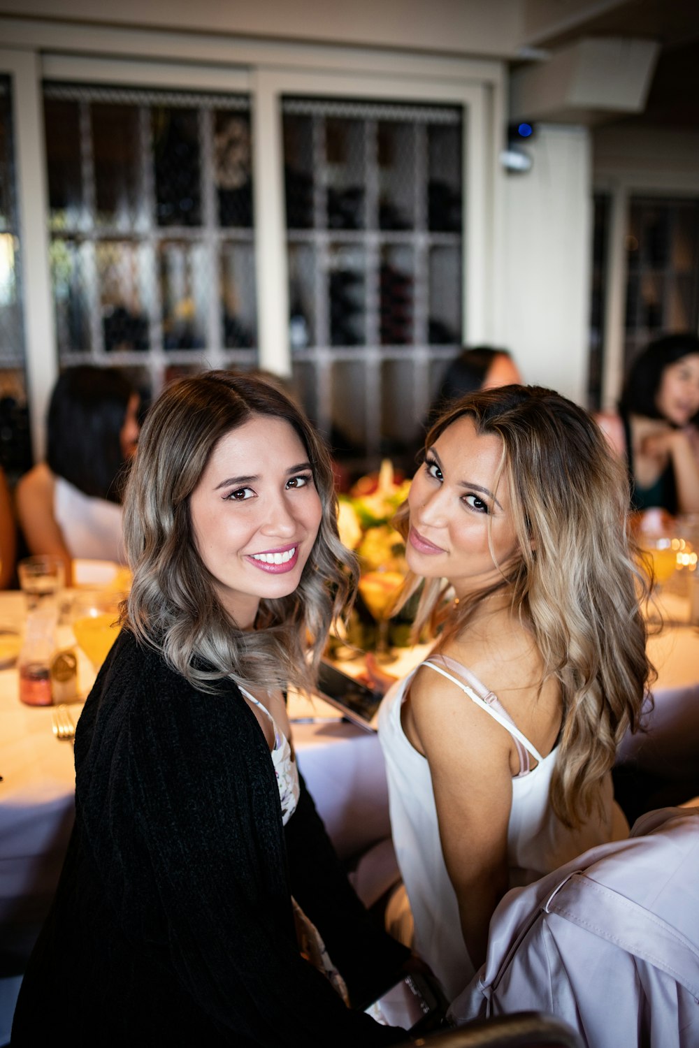 two women sitting at the table