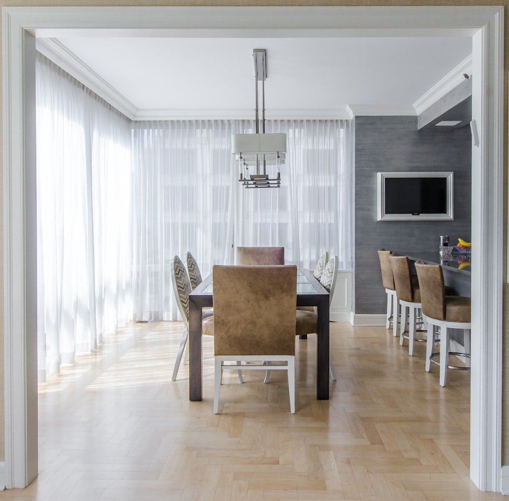 brown wooden dining furniture set inside room