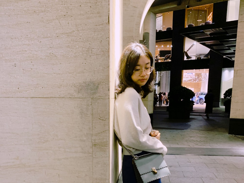 woman wearing white long-sleeved shirt