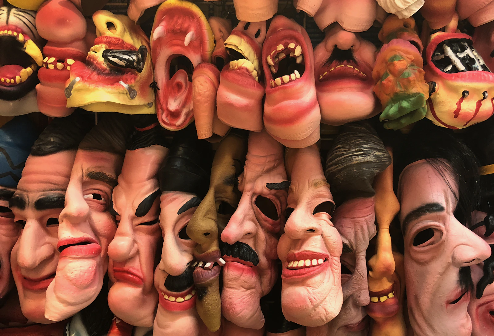 Theatrical comedy and tragedy masks side by side