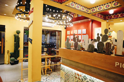 Warm interior of Sabor Maya restaurant featuring minimalist design and terracotta accents.