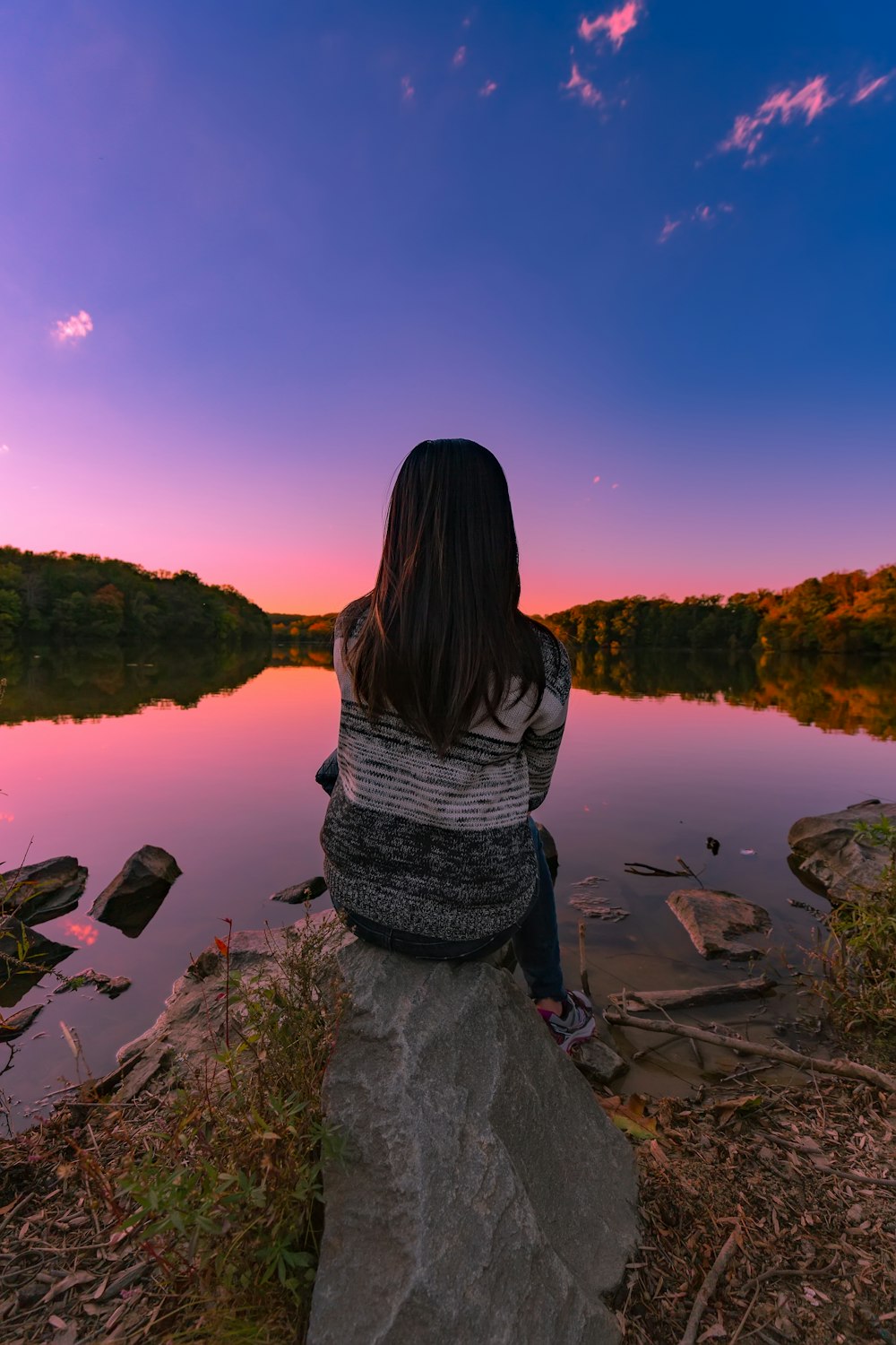 woman sitting on stone