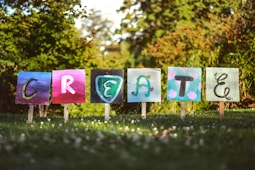 selective focus photo of create signage