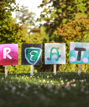 selective focus photo of create signage