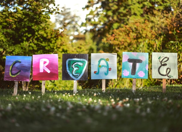 selective focus photo of create signage