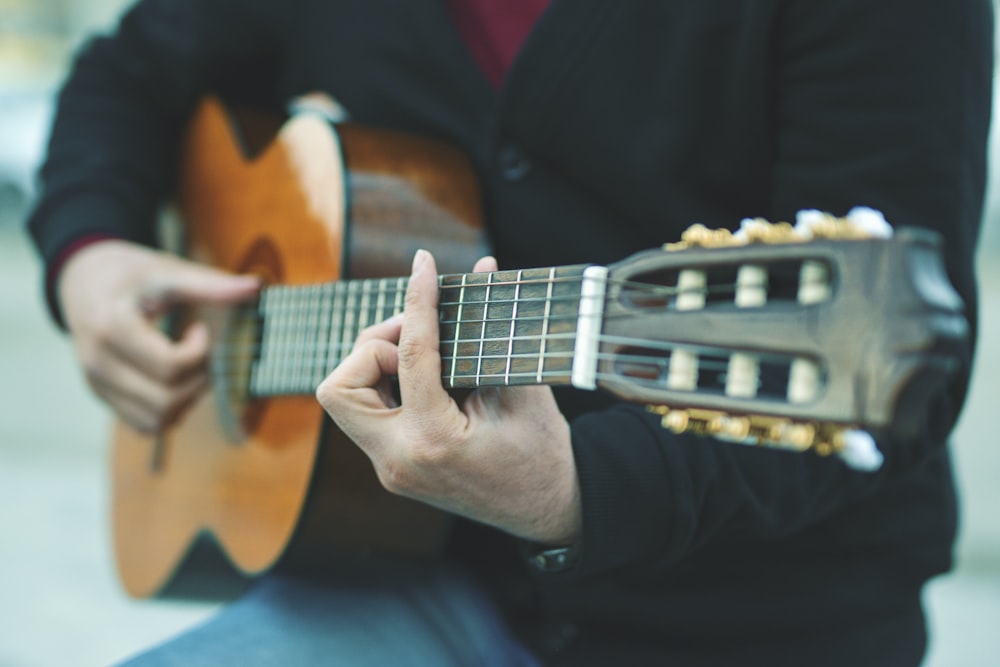 person playing guitar