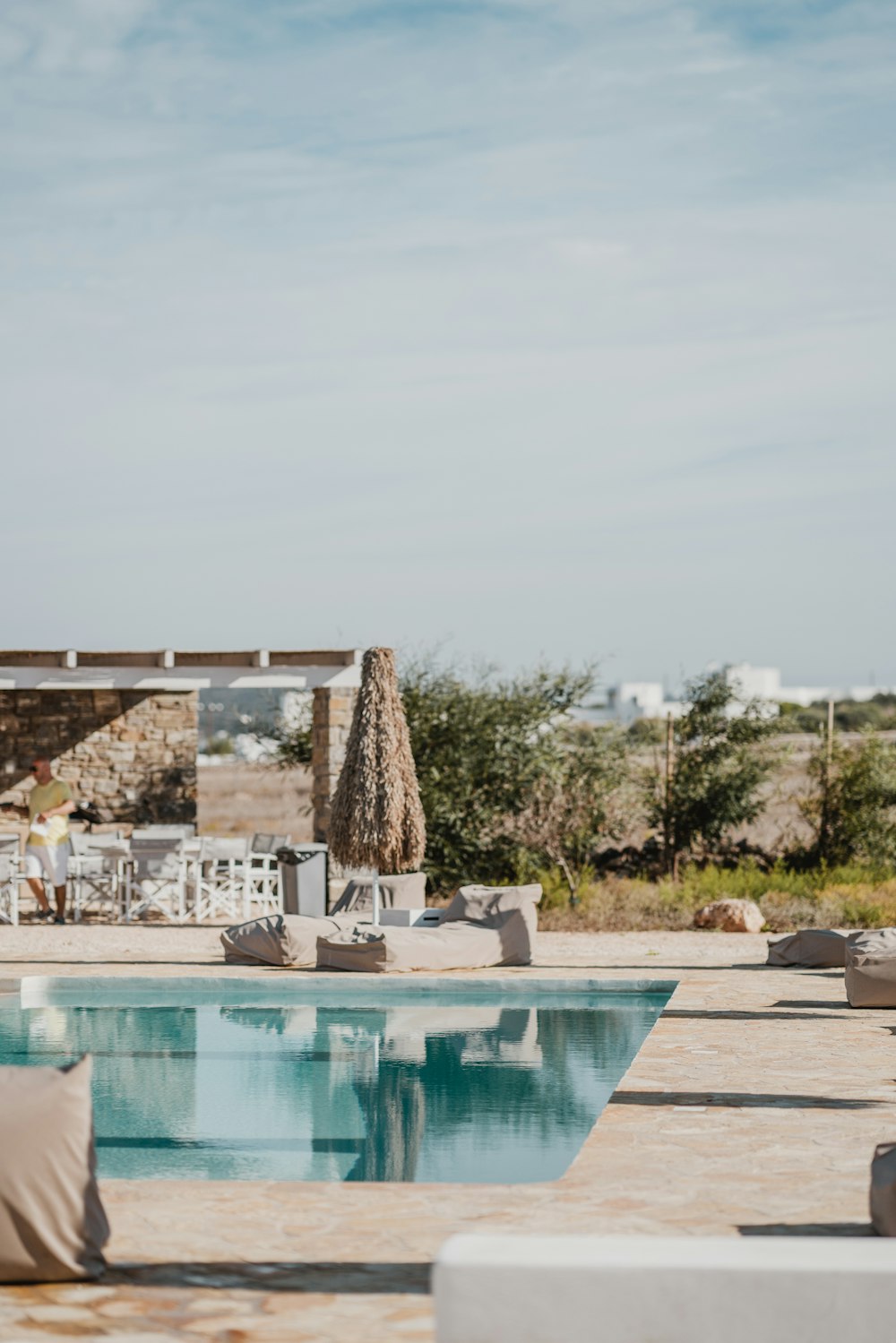 rectangular white outdoor swimming pool