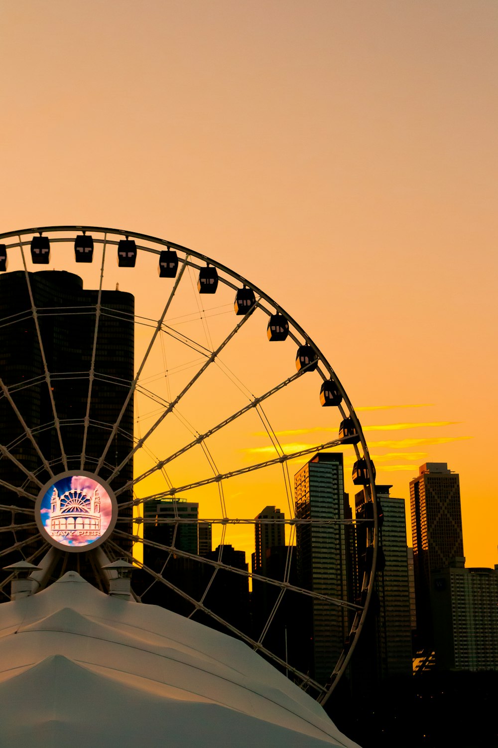 silhouette of Ferris wheel during golden hour